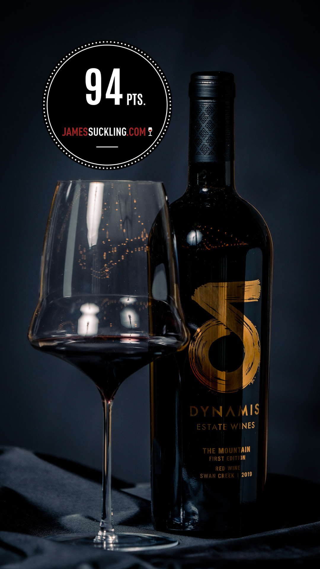 Red in glass and bottle with award sign that read '94 points'