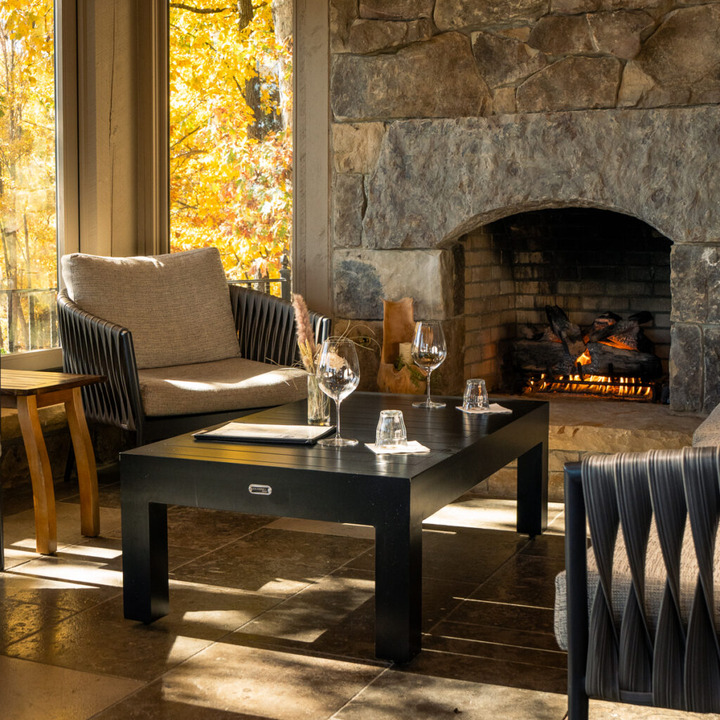 Inside of a lodge with wine table setup.